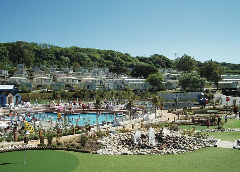 Pool and caravans at accessible disabled holiday park on the Dorset coast