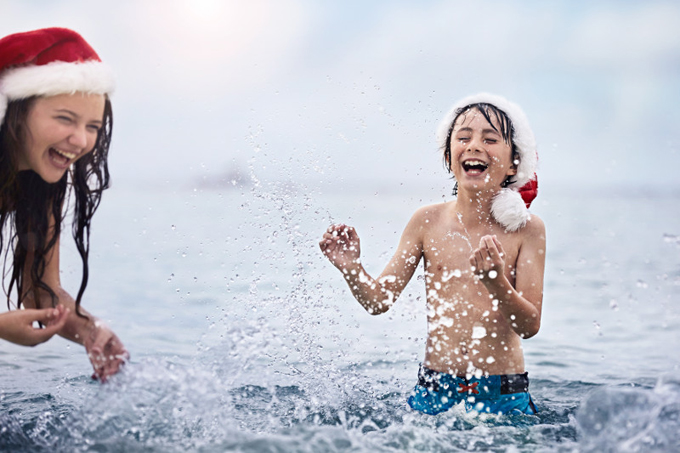 Children playing in the sea on a Princess cruise at Christmas