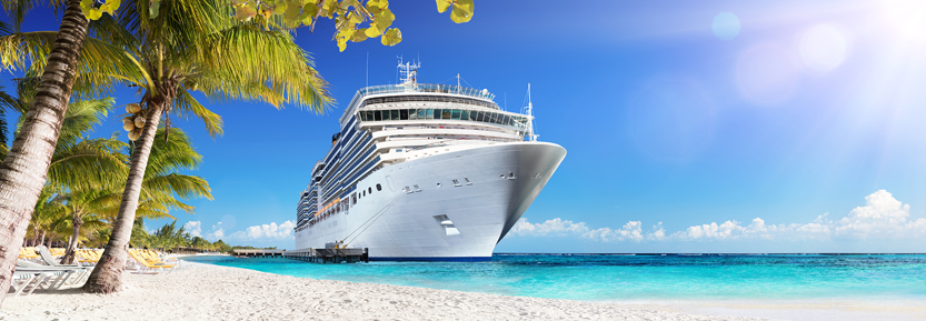 Cruise ship by an exotic beach in the Caribbean