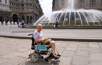 Holiday maker in a Mobility at Sea power chair