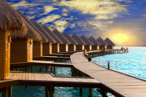 Traditional houses on stilts in the water in the Maldives, Indian Ocean