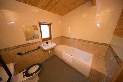 Bedroom in accessible lodge with profiling bed in Burnham-on-Sea, Somerset