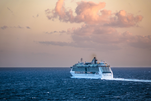A cruise ship sails on the Baltic Sea under a cloudy sky