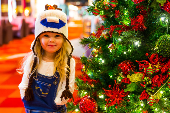 Little girl and Christmas tree on a P&O cruise