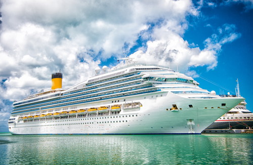 Cruise ship docked at port on a sunny day