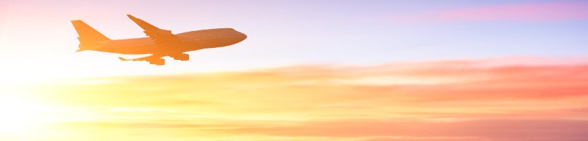 Aeroplane flying in the sunset