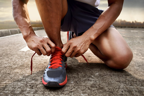 Man tying trainers