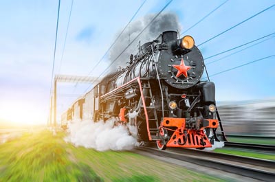 Black steam train in motion