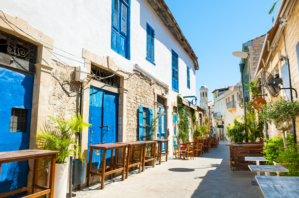 Traditional street with white houses in Limassol, Cyprus
