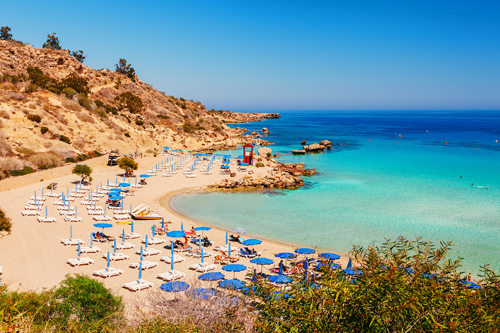 Sunbathers on a beach in Ayia Napa, Cyprus