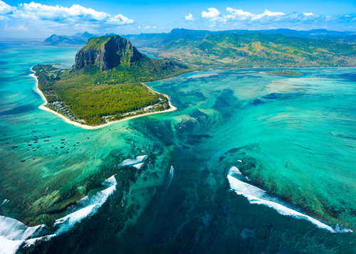 Aerial view of the green island of Mauritius, blue seas and coral reefs, Indian Ocean