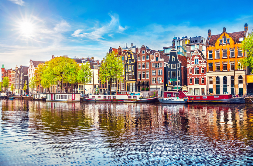 Colourful buildings on a canal in Amsterdam, the Netherlands