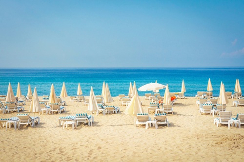 Deck chairs and umbrellas on a beautiful beach in Alanya, Antalya, Turkey