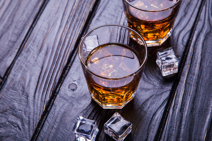 Glasses of whisky on a table