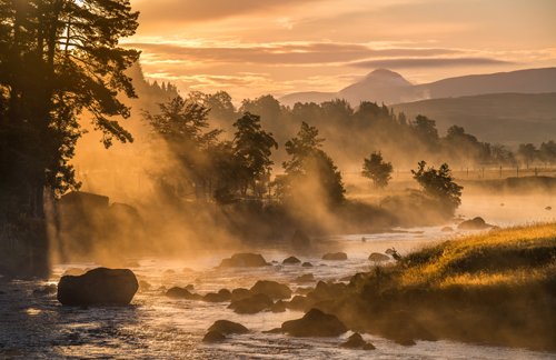 Magical misty river in the mountains of Perthshire, Scotland