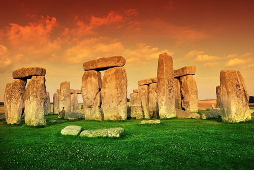 Stonehenge against an orange sky, Wiltshire