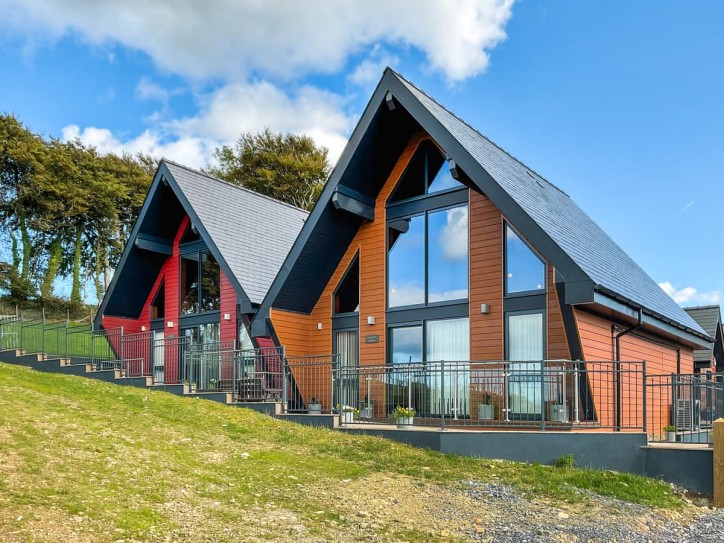 Luxury countryside lodge with stunning hill views. Card image